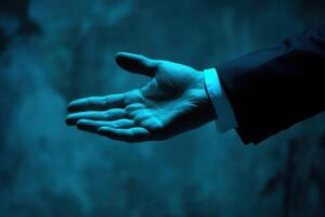 Elegant hand gesture in a dimly lit setting, conveying invitation and mystery photo