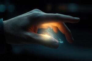 A futuristic hand manipulating a glowing holographic object in a dark, tech-inspired environment photo