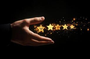 Hand casting golden stars in a dark setting, symbolizing success and achievement photo