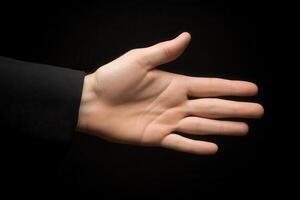 Open hand gesture against a dark background, symbolizing welcome or invitation photo
