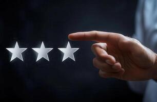 Hand selecting a star rating in a dark environment, symbolizing feedback and evaluation photo