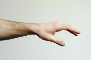 Human hand reaching out against a neutral background, symbolizing connection and interaction photo