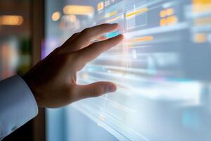 Futuristic hand interacting with a transparent touchscreen in a modern office environment photo