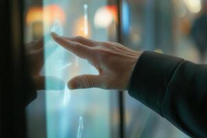 Person interacting with a glowing touchscreen interface in a modern urban environment photo