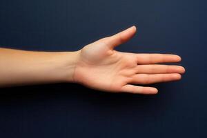 Open hand against a dark background, showcasing the palm and fingers for demonstration photo