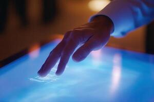 Person interacting with a glowing touchscreen interface in a modern, tech-savvy environment photo