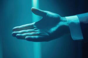 Hand reaching out in a dimly lit environment, symbolizing connection and opportunity photo
