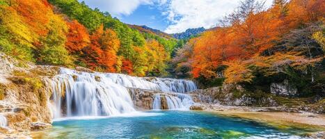 Autumn Waterfall Landscape Cascading water, vibrant fall foliage, mountain backdrop photo