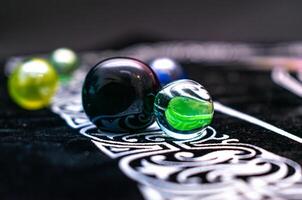 Group of transparent marbles forming a gentle visual rhythm photo