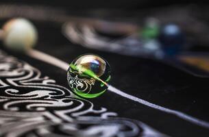 Marble with mystical symbols on textured velvet, soft and atmospheric photo