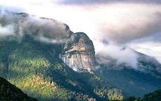 Alpine Mountain Ridge under Stormy Sky photo