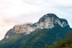 Sunlight falling on alpine peaks and ridges photo