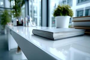 Notebook on a bright reflective surface near window light photo