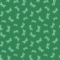 Seamless dragonfly silhouettes pattern on green background vector
