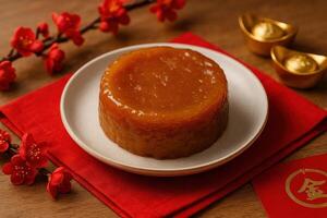 Traditional Chinese New Year Sweet Cake Close Up with Festive Setting in Soft Natural Light on Red Background with Gold Accents photo