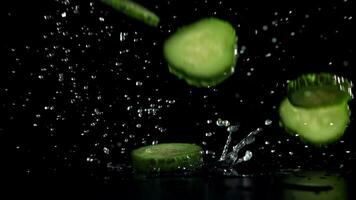 Sliced cucumbers fall on the table. Filmed on a high-speed camera at 1000 fps. High quality FullHD footage video