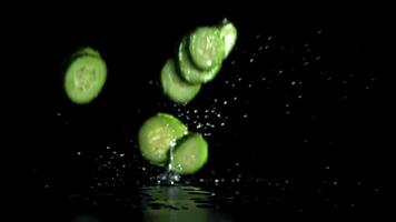 Sliced cucumbers fall on the table. Filmed on a high-speed camera at 1000 fps. High quality FullHD footage video