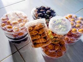 A group of containers filled with different types of food photo