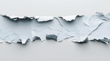 A piece of paper torn in half with a hole in it photo