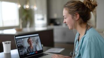 A healthcare worker conducts a telehealth session interacting with a patient through a laptop emphasizing the importance of remote care in modern medicine photo