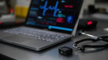 An overhead view of a modern clinic desk featuring a digital stethoscope connected via Bluetooth to a laptop with a screen displaying patient heart data being recorded photo