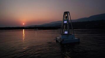 A serene sunset backdrop illuminates a buoy floating on calm waters with digital screens displaying realtime data on oxygen levels and feeding schedules for the aquatic ecosystem photo