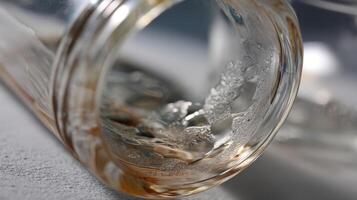 An image capturing the intricate details of a transparent bottle with a polarized lens filter overlay that emphasizes the contrast between flawless areas and visible defects photo