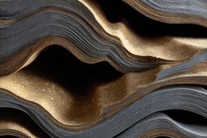 A pile of books with gold and black on them photo