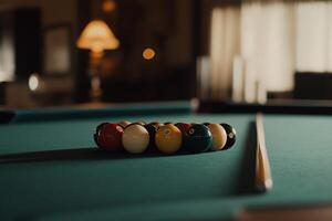 Billiards table with balls arranged for game. Soft lighting in the background photo