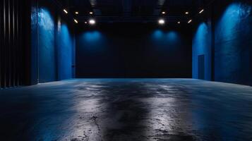 Empty room with blue lighting and concrete floor photo