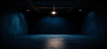 Dark, empty, industrial space with single light source photo