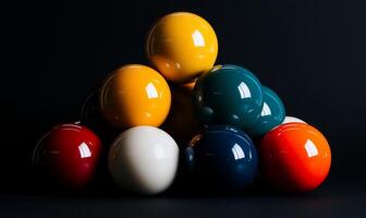 Colorful billiard balls stacked in a pyramid shape against a dark background. Detailed view of the glossy surfaces and varied colors photo