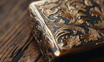 A close up of a gold and black box photo