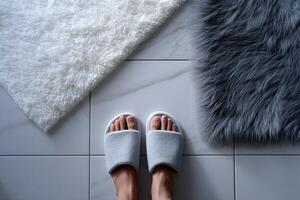 Cozy bathroom slippers on a tiled floor, with plush rugs photo