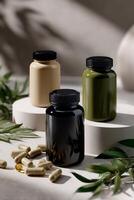 Three bottles of vitamins and supplements sit on a table photo