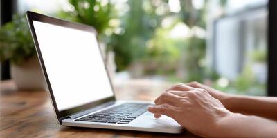 Laptop computer use. Hands typing on keyboard photo