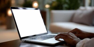 Laptop open, hands typing on keyboard photo