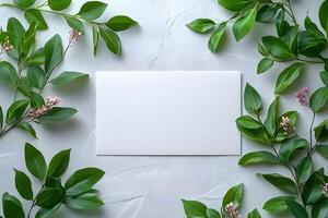 Blank Card on Textured Surface with Lush Green Foliage for Nature-Inspired Designs photo