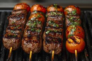Grilled Beef Kebabs with Cherry Tomatoes and Herbs on Barbecue Grill photo