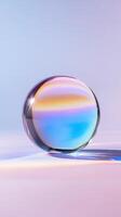 Iridescent reflecting sphere glass multicolored light, casting prismatic shadow against smooth gradient surface. Abstract background photo