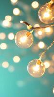 Warm light a hanging against a green backdrop, evoking bulbs festive holiday atmosphere. Abstract background photo