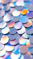 Shimmering, surface. iridescent sequins forming multicolored textural overlapping Abstract background photo