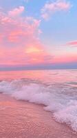 water pastel pink sunset reflecting on calm ocean Soft with gentle wave washing ashore. Abstract background photo