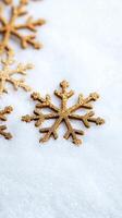 Golden atmosphere silver snowflakes falling softly creating a festive christmas background on a blurred snowy and photo