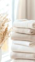 Chunky warm sweaters stacked neatly, displaying soft wool textures and knit neutral colors perfect for cold weather comfort photo
