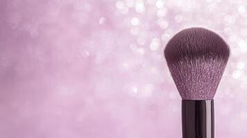 Professional makeup brush on a vibrant pink background with shimmering bokeh, highlighting beauty tools and cosmetics photo