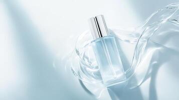 Sleek glass skincare bottle with silver dropper hovering above rippling water, conveying serum purity and luminous hydration photo