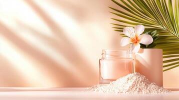 Face powder and cream containers are presented on a white surface with a tropical leaf and pink flowers, illuminated against by light natural an orange backdrop photo