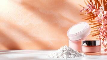 Face powder and cream containers are presented on a white surface with a tropical leaf and pink flowers, illuminated by natural light against an orange backdrop photo
