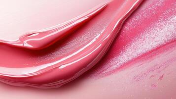 Smears of shiny pink capturing gloss create a beautiful, textured, flowing pattern, lip the essence of beauty and cosmetics photo